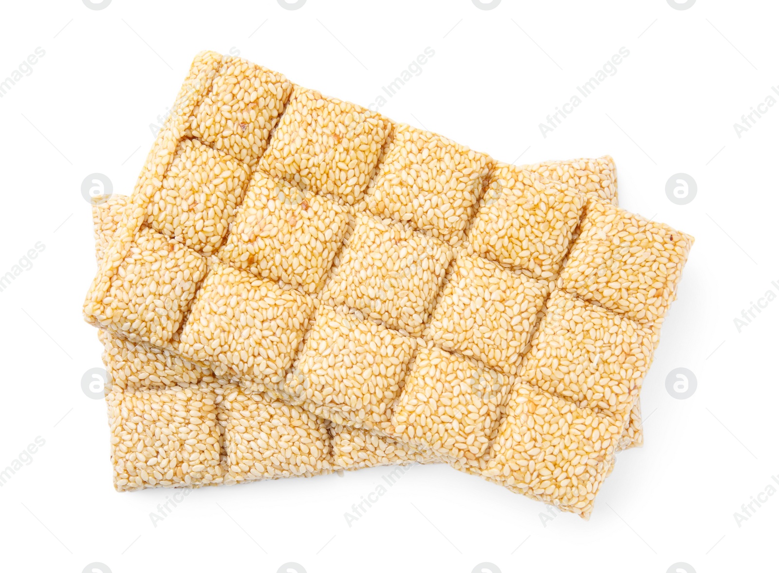 Photo of Delicious sesame kozinaki bars on white background, top view