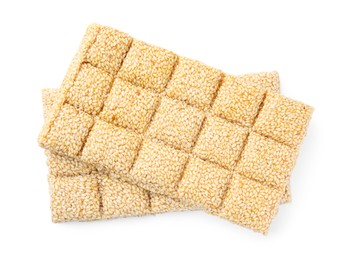 Photo of Delicious sesame kozinaki bars on white background, top view