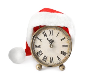 Alarm clock with Santa hat on white background. New Year countdown