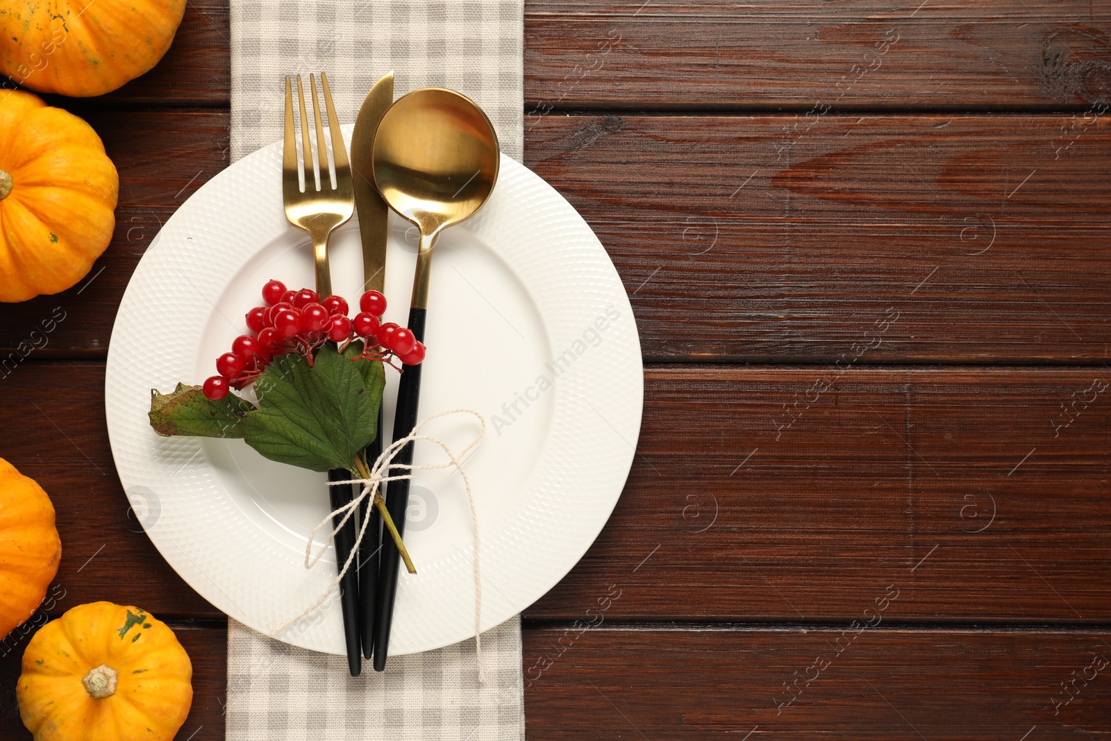 Photo of Beautiful autumn table setting on wooden background, flat lay. Space for text