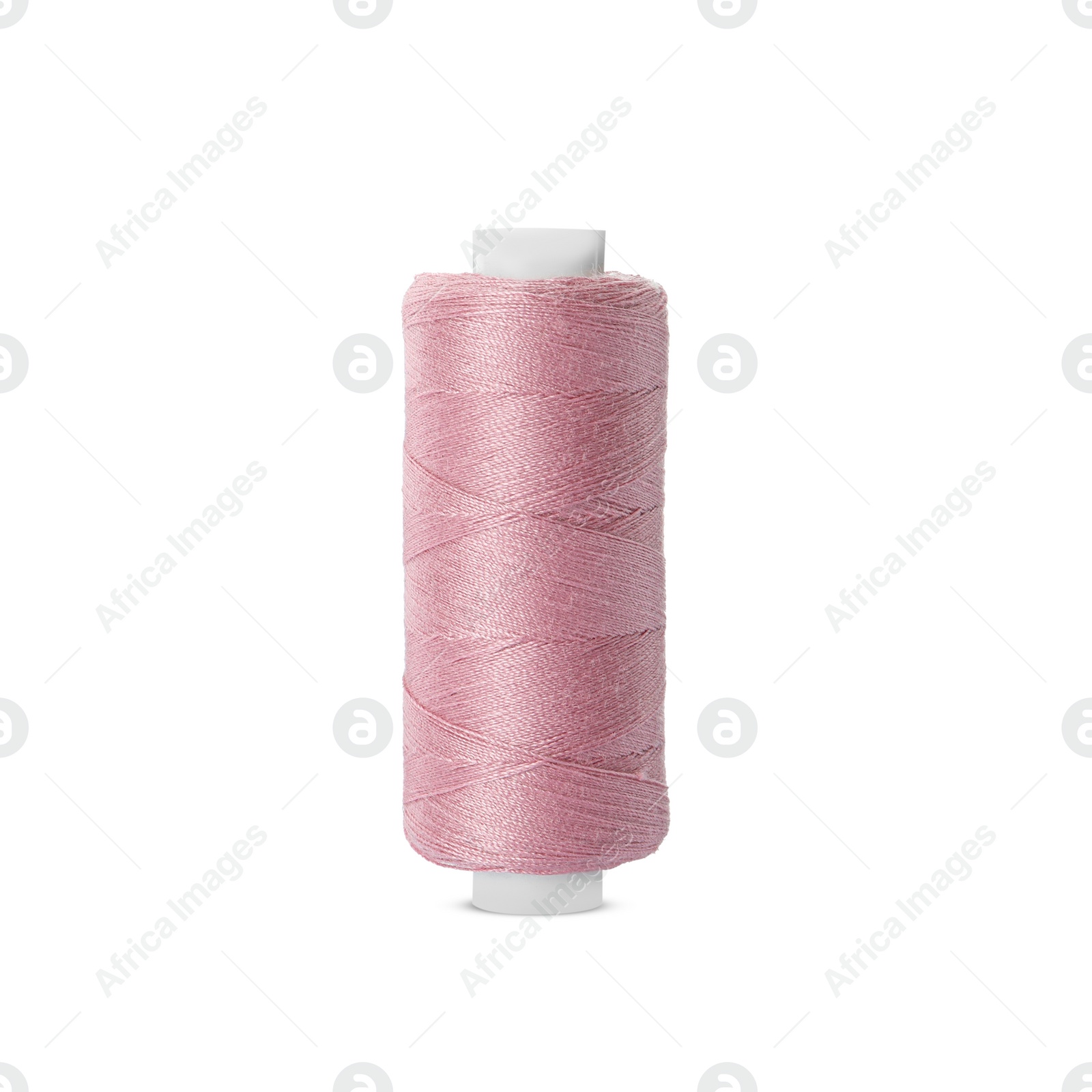 Photo of Spool of pink sewing thread isolated on white