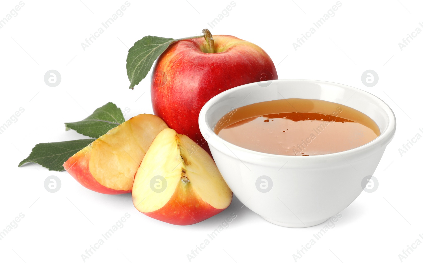 Photo of Delicious apples, leaves and bowl of honey isolated on white