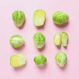 Fresh Brussels sprouts on color background, flat lay