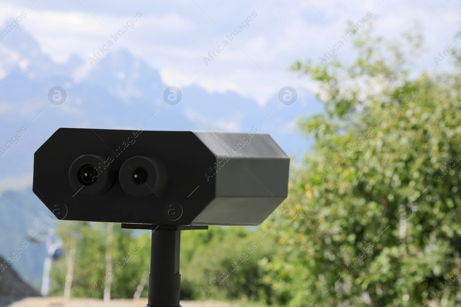 Photo of Metal tower viewer installed outdoors, closeup. Space for text