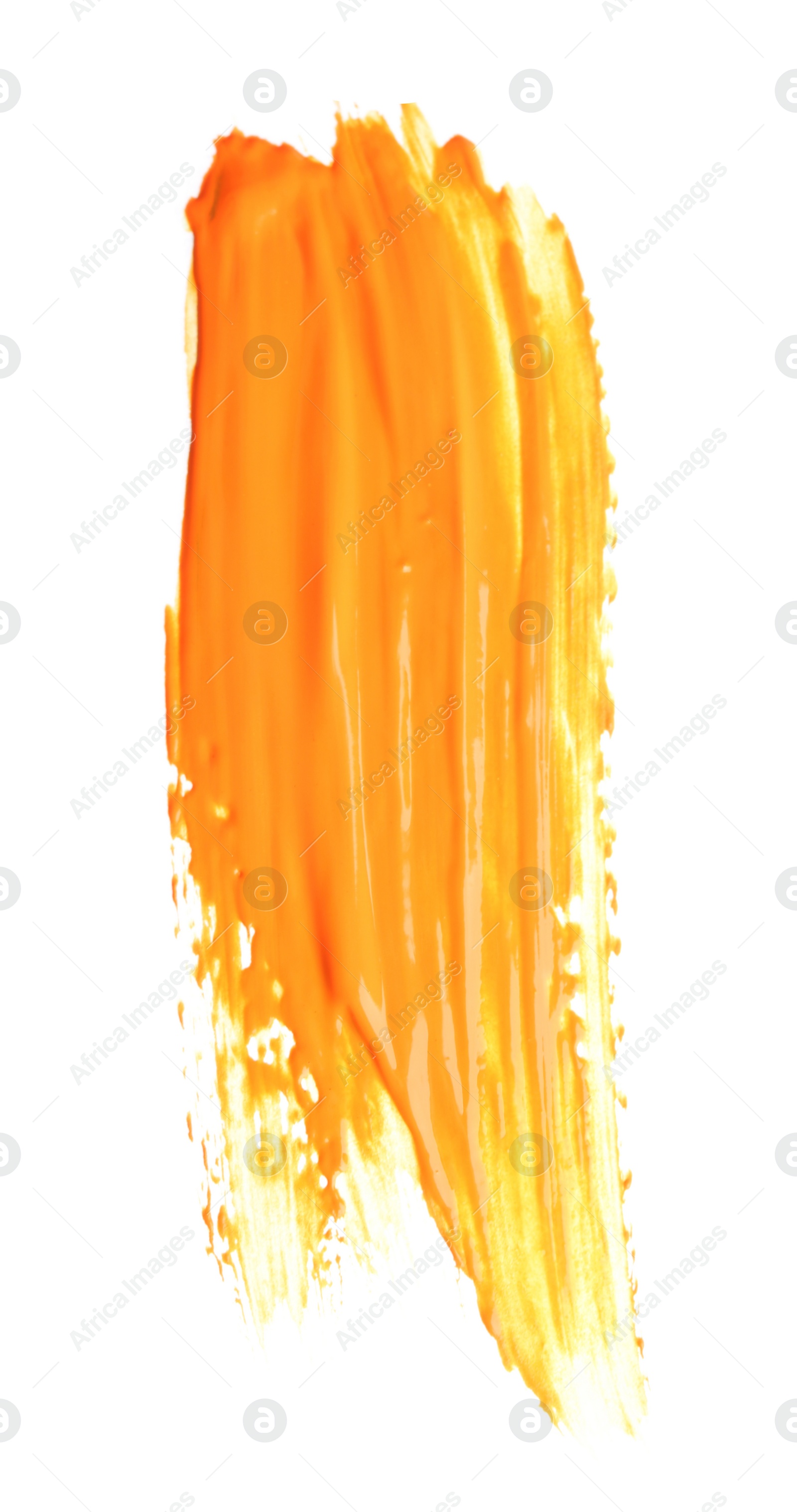 Photo of Abstract brushstroke of orange paint isolated on white