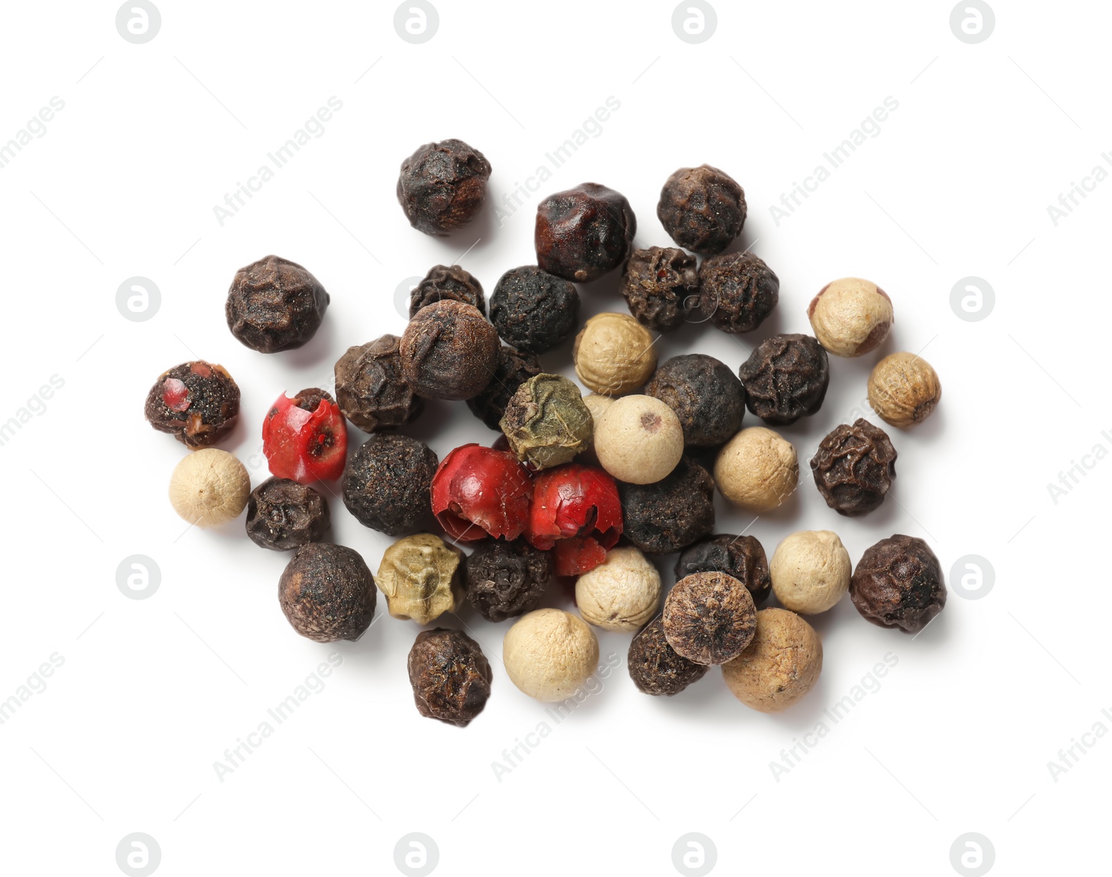 Photo of Aromatic spices. Pile of different peppers isolated on white, top view