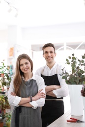 Photo of Male and female florists in flower shop
