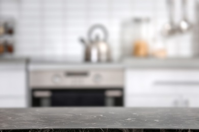 Photo of Countertop and blurred view of kitchen interior. Idea for home design