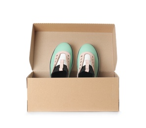 Photo of Pair of stylish modern shoes in carton box on white background