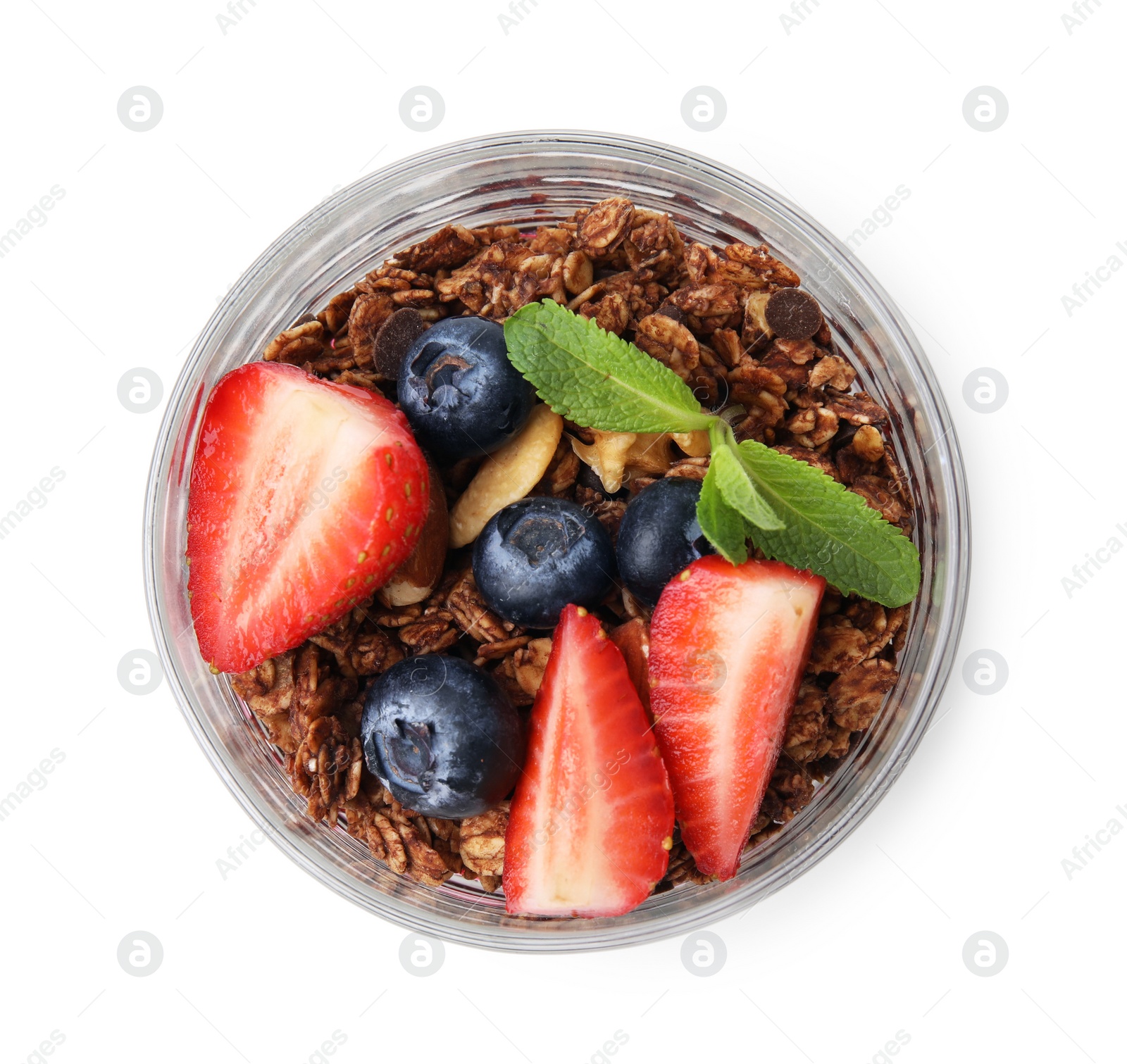 Photo of Tasty granola with berries and mint in glass isolated on white, top view