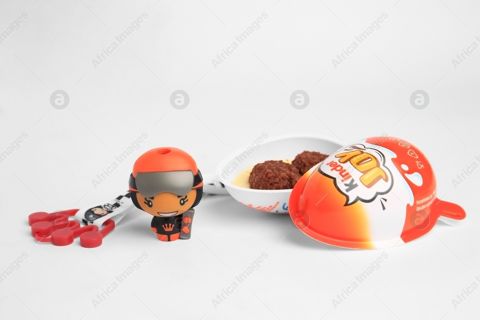 Photo of Sveti Vlas, Bulgaria - June 26, 2023: Kinder Joy Egg, sweet candies and toys on white background