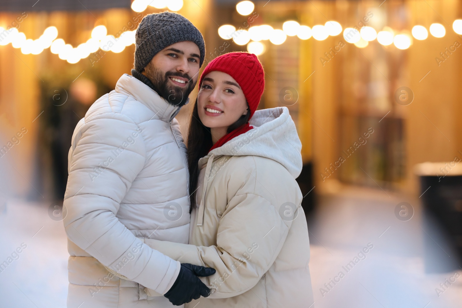 Photo of Lovely couple spending time together on city street