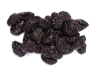 Heap of sweet dried prunes on white background, top view