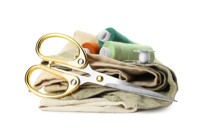 Photo of Scissors, spools of threads and sewing tools on white background