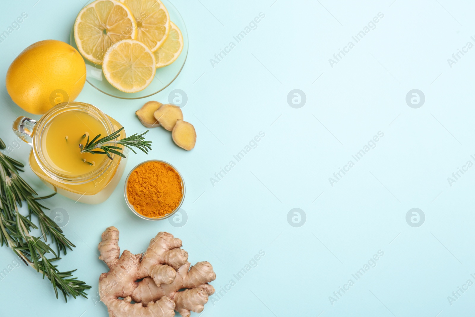 Photo of Flat lay composition with immunity boosting drink on light blue background. Space for text