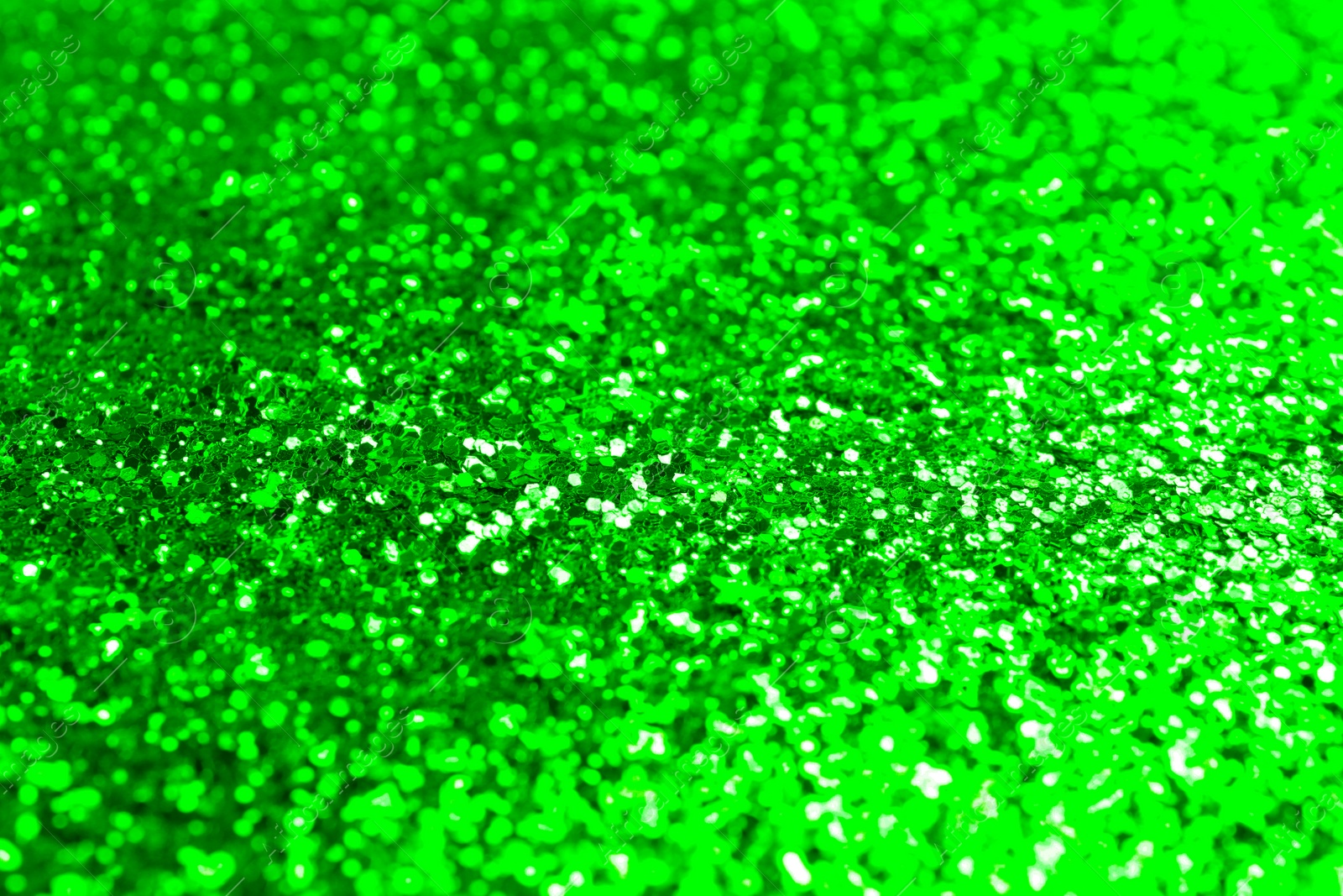 Image of St. Patrick day. Shiny green glitter, closeup