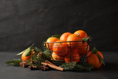 Photo of Christmas composition with tangerines on black background