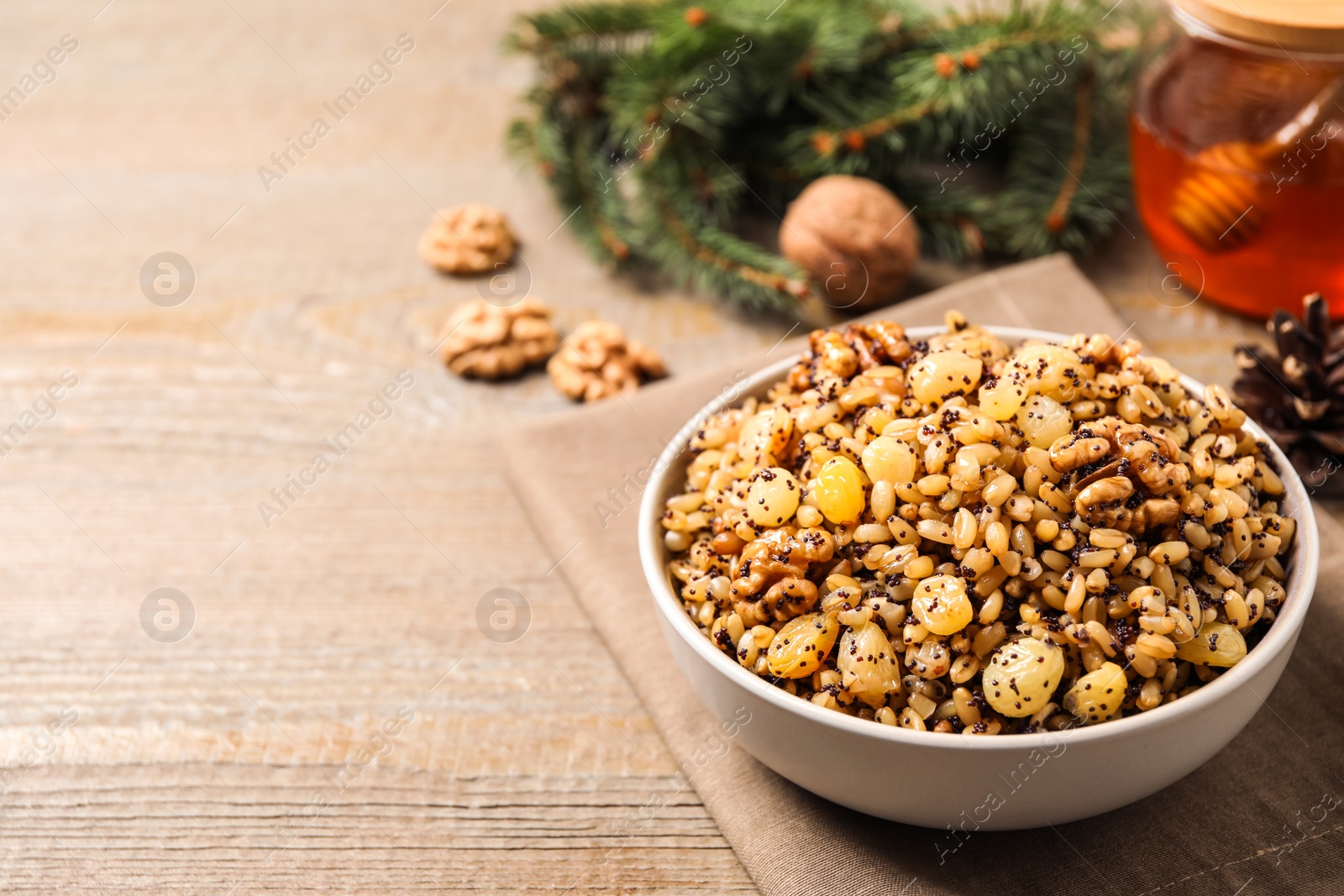 Photo of Traditional Christmas slavic dish kutia served on wooden table. Space for text