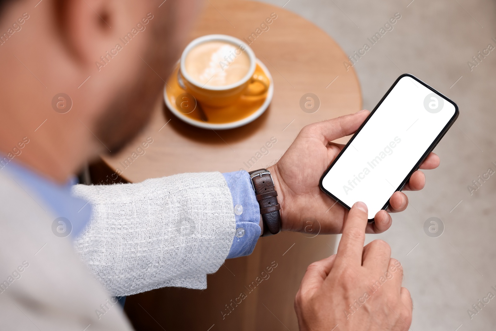 Photo of Man using mobile phone at table, above view. Space for text