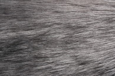 Photo of Texture of grey faux fur as background, closeup