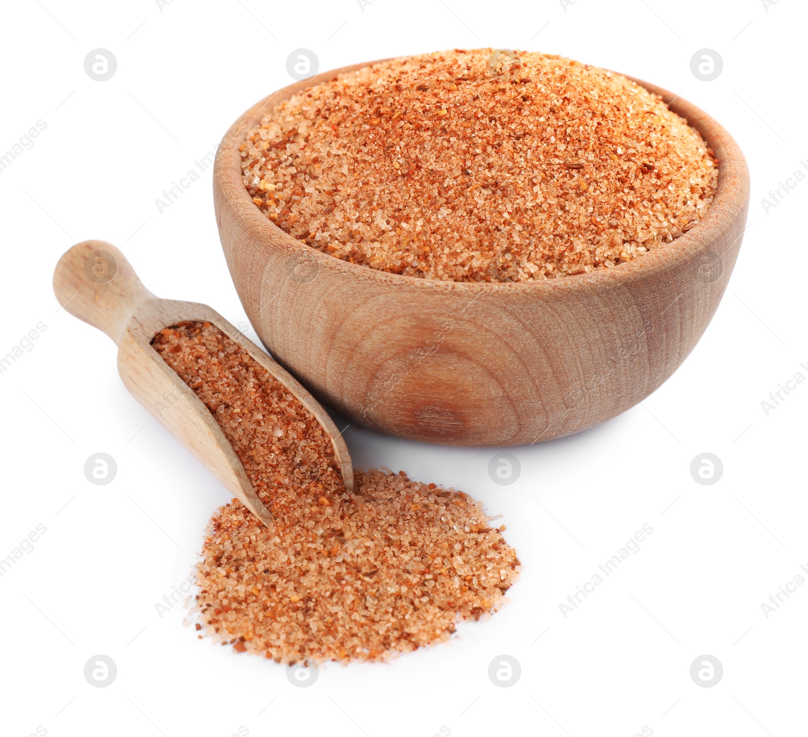 Photo of Wooden bowl and scoop with pink salt on white background