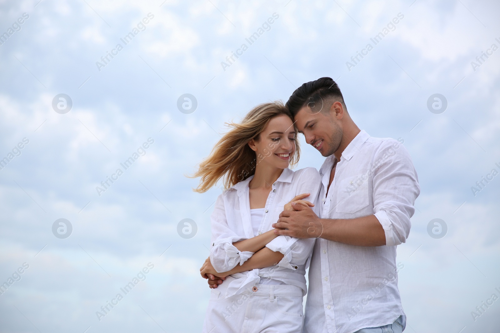 Photo of Happy couple on beach, space for text. Romantic walk