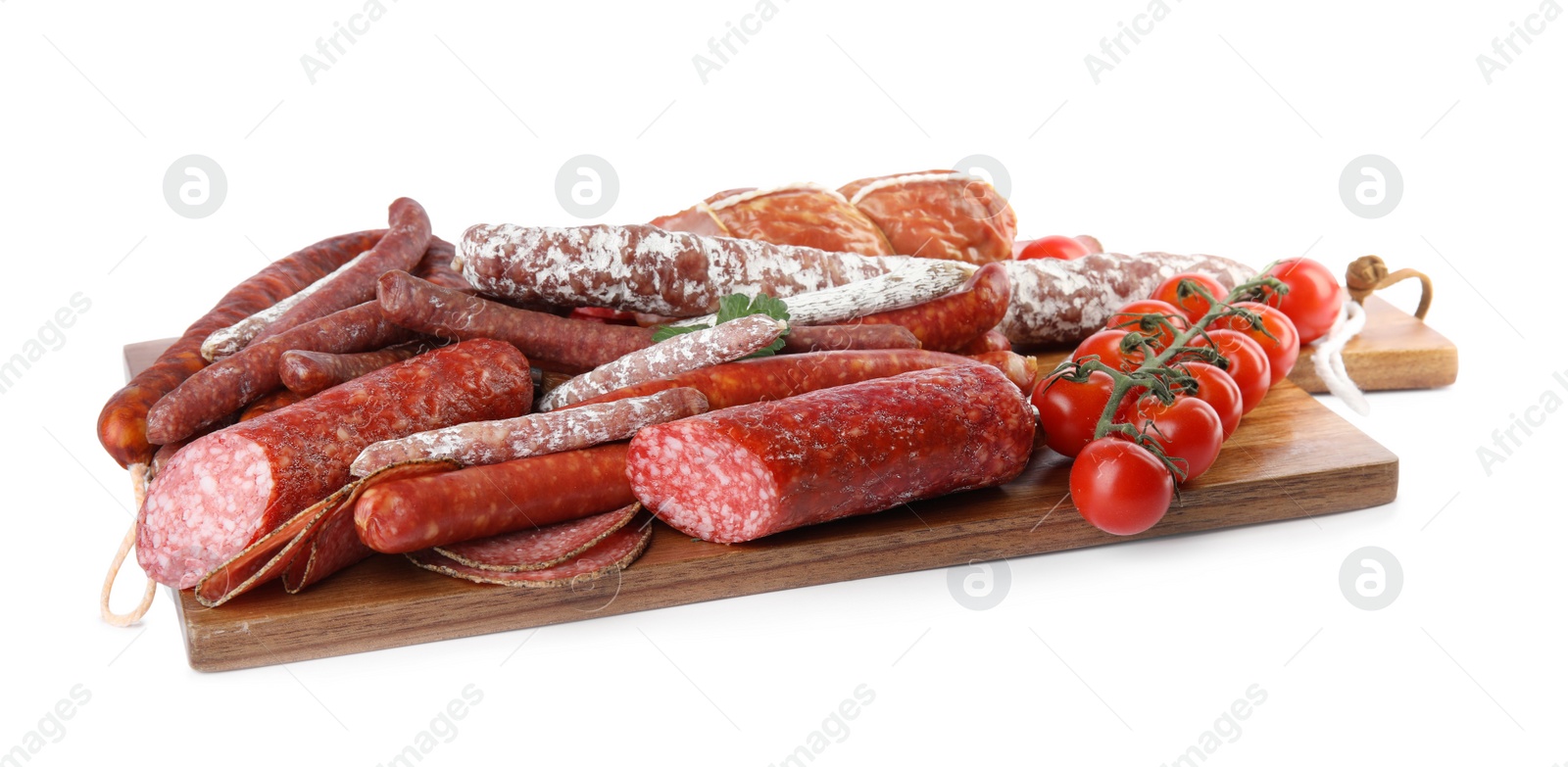 Photo of Wooden board with different tasty sausages isolated on white