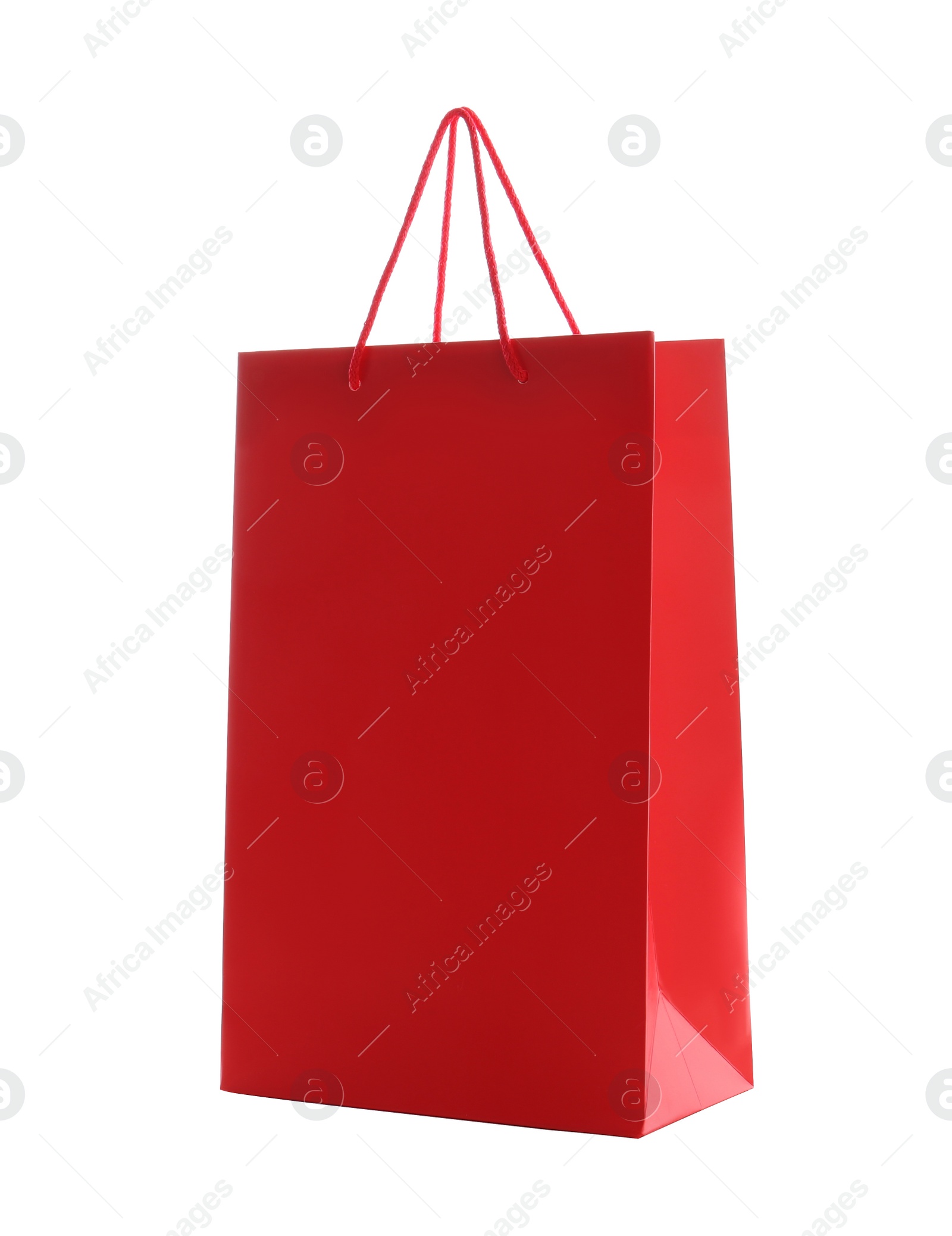 Photo of Red paper shopping bag isolated on white