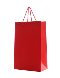 Photo of Red paper shopping bag isolated on white