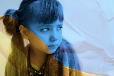Image of Double exposure of national flag and sad little girl. Stop war in Ukraine