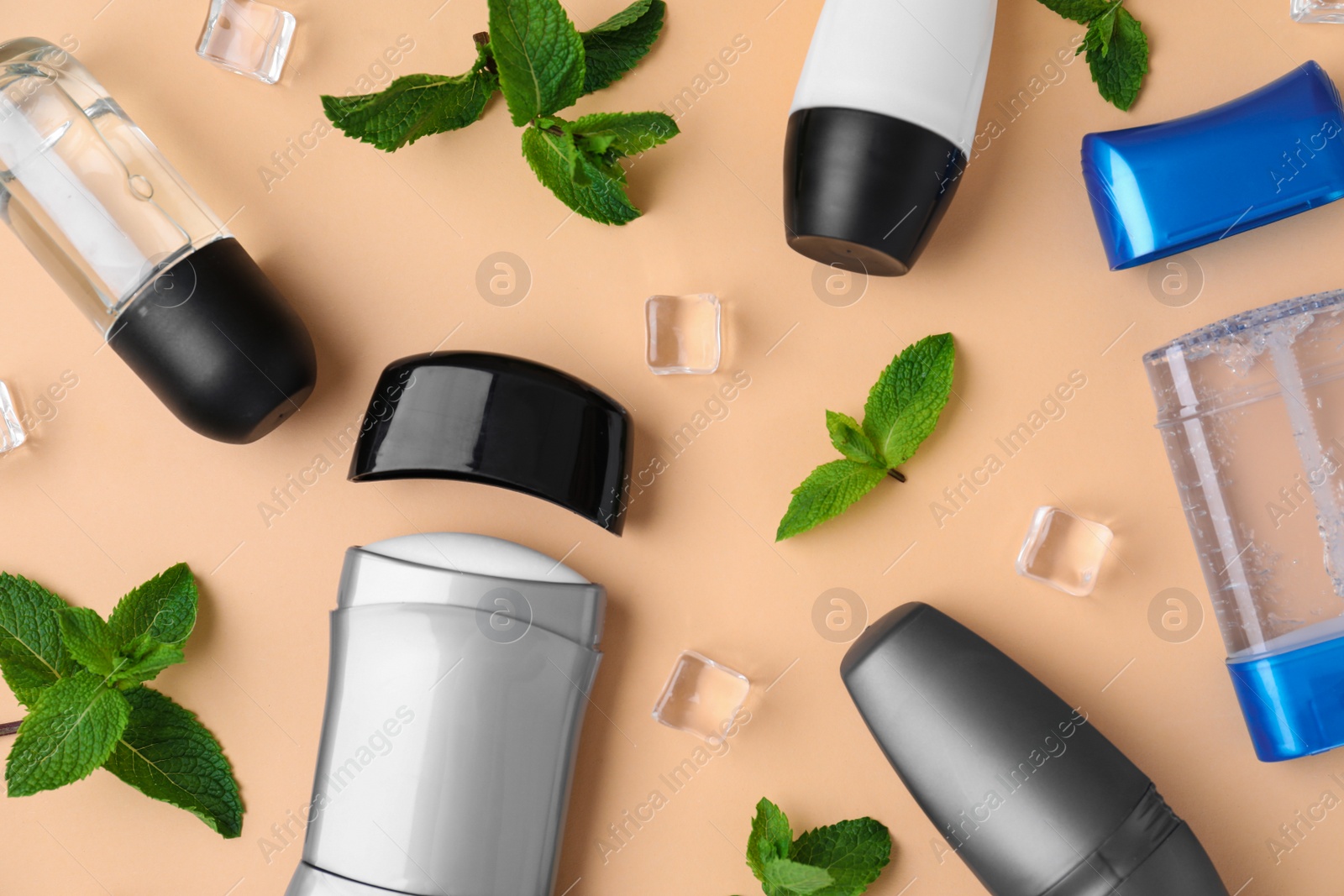 Photo of Flat lay composition with different male natural deodorants on beige background