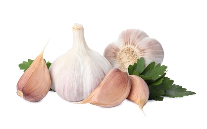 Photo of Fresh garlic bulbs and cloves with parsley on white background. Organic food