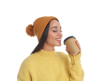 Photo of Happy beautiful woman with paper cup of mulled wine on white background