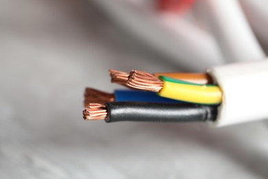 Photo of Colorful electrical wire on gray background, closeup