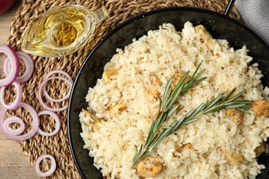 Photo of Delicious chicken risotto served on table, closeup