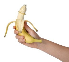 Woman holding banana in condom on white background, closeup. Safe sex concept