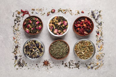 Flat lay composition with different dry teas on light table