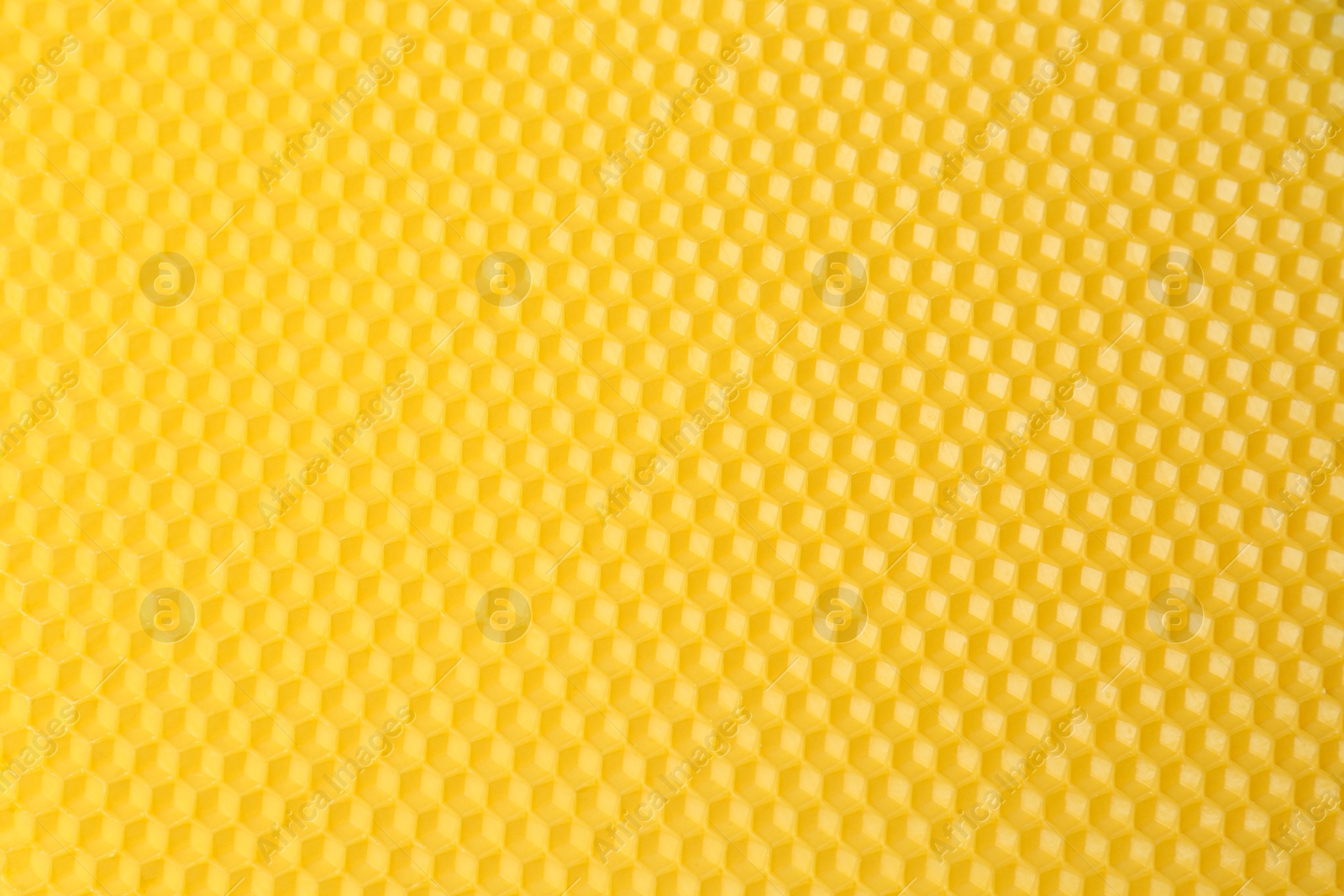 Photo of Natural beeswax sheet as background, top view