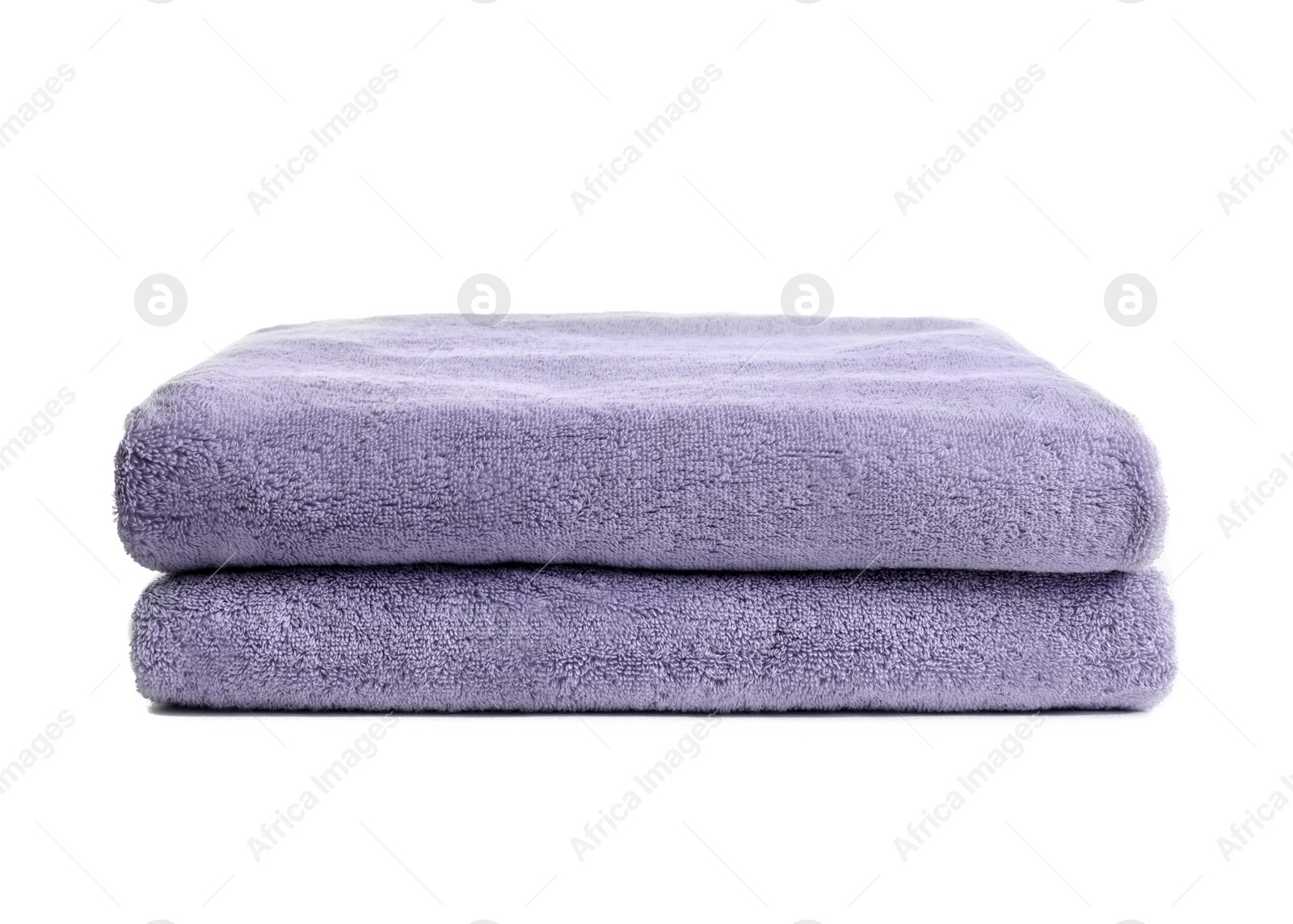 Photo of Folded clean soft towels on white background