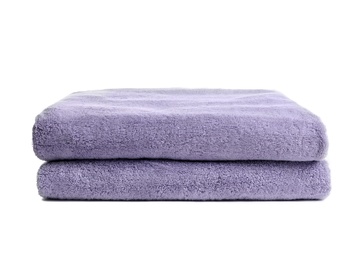 Folded clean soft towels on white background