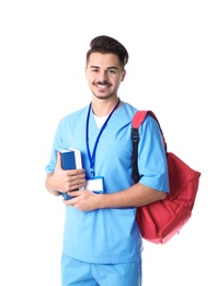 Young medical student with books and backpack on white background