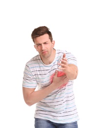 Young man having heart attack on white background