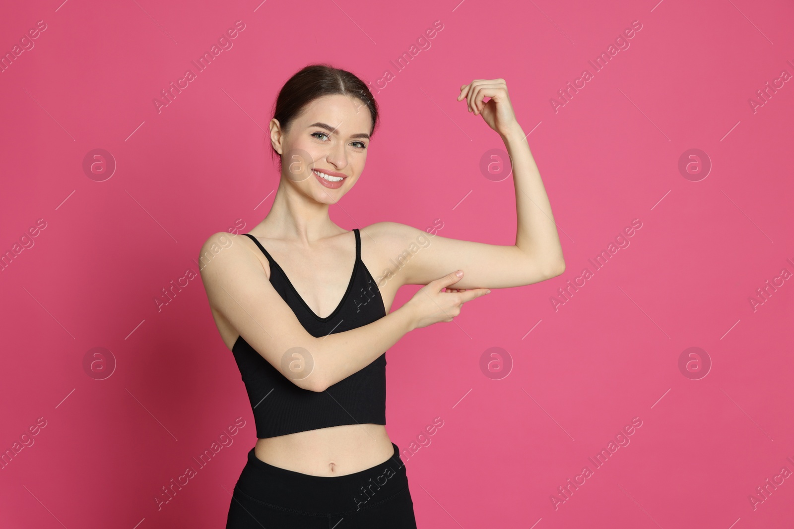 Photo of Slim young woman with thin arm on pink background, space for text. Weight loss surgery