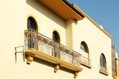 Photo of Exterior of building with windows and balcony