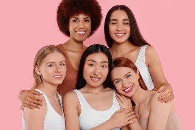 Photo of Portrait of beautiful young women on pink background