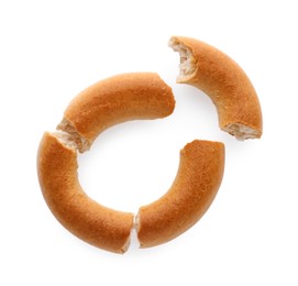 Photo of Crushed tasty dry bagel (sushki) isolated on white, top view