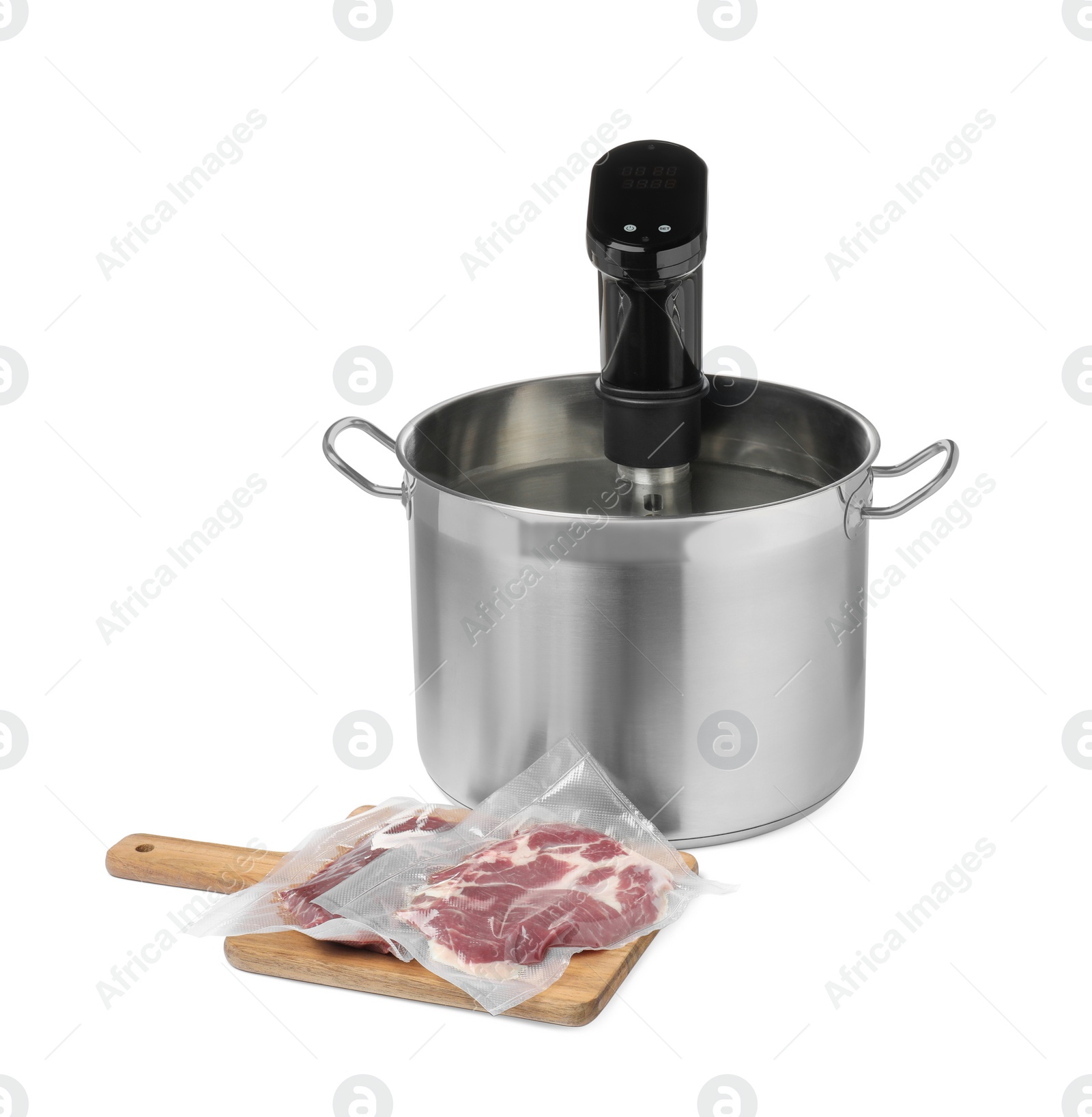 Photo of Thermal immersion circulator in pot and meat on white background. Vacuum packing for sous vide cooking