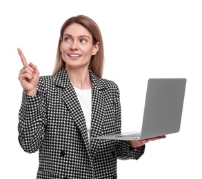 Beautiful happy businesswoman with laptop pointing at something on white background