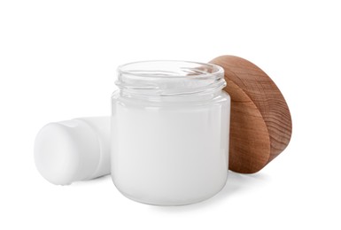 Photo of Jar and tube of hand cream on white background