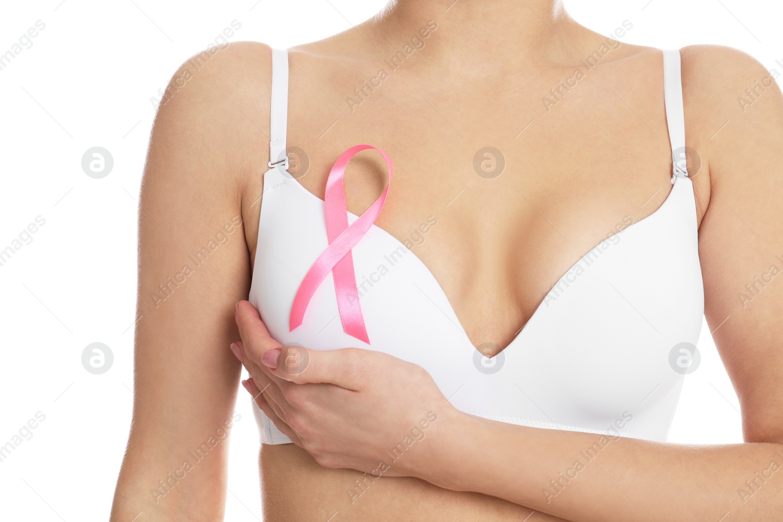 Photo of Woman with pink ribbon on white background, closeup. Breast cancer awareness